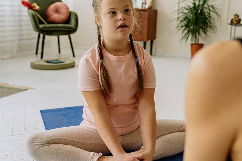 A child with disabilities doing yoga