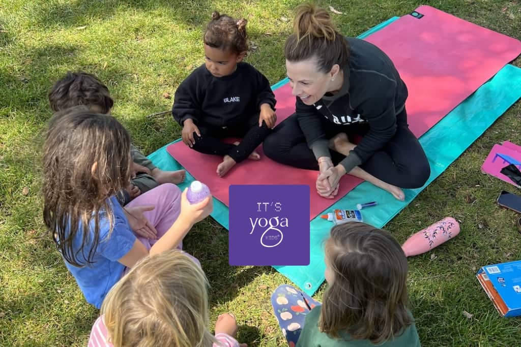 A yoga teacher with kids making a recycled glitter bottle