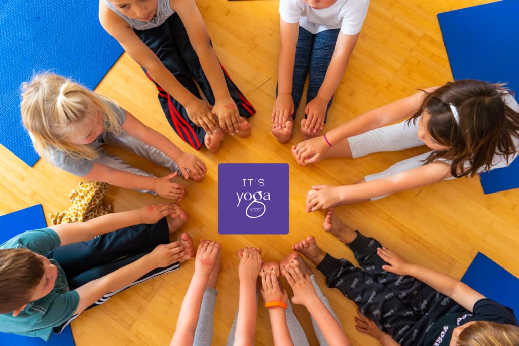 A group of children with their feet in a circle