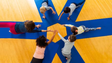 A group of kids doing yoga at It's Yoga Kids®